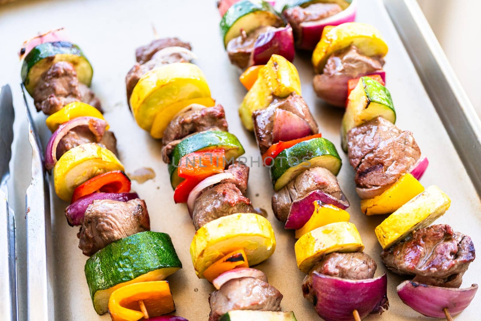 Grill Delights-Beef and Veggies Sizzling on Skewer by arinahabich