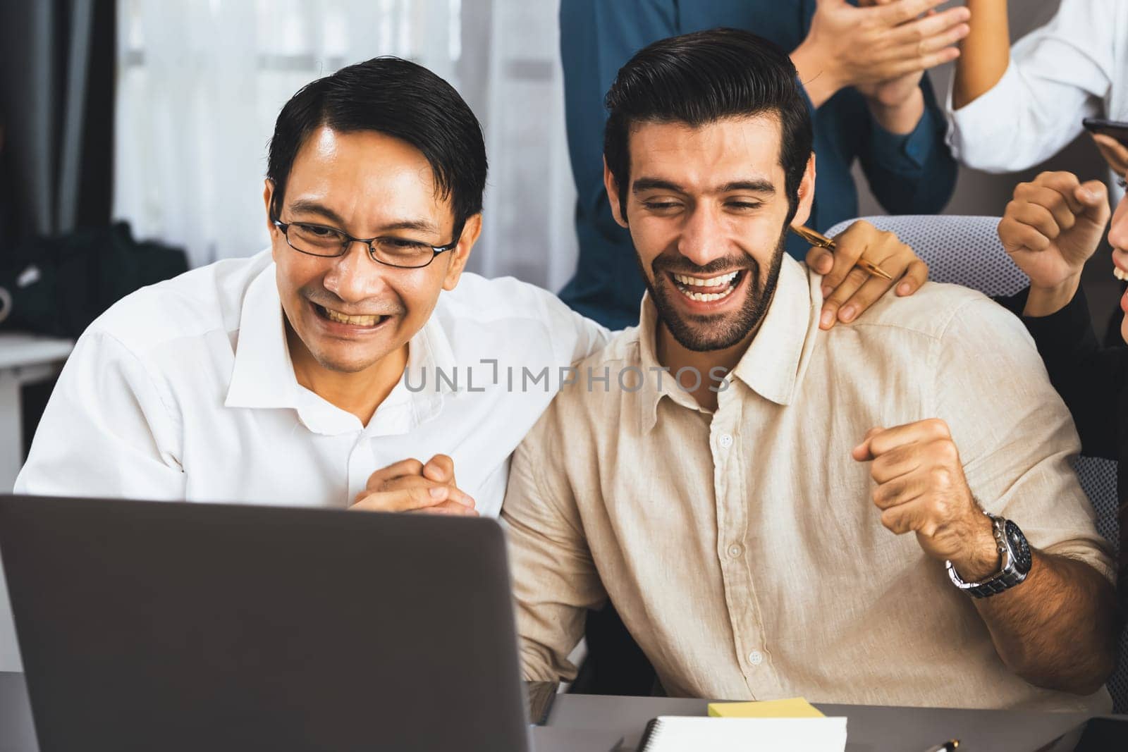 Excited and happy office worker employee celebrate after make successful strategic business marketing planning. Teamwork and positive attitude create productive and supportive workplace. Prudent