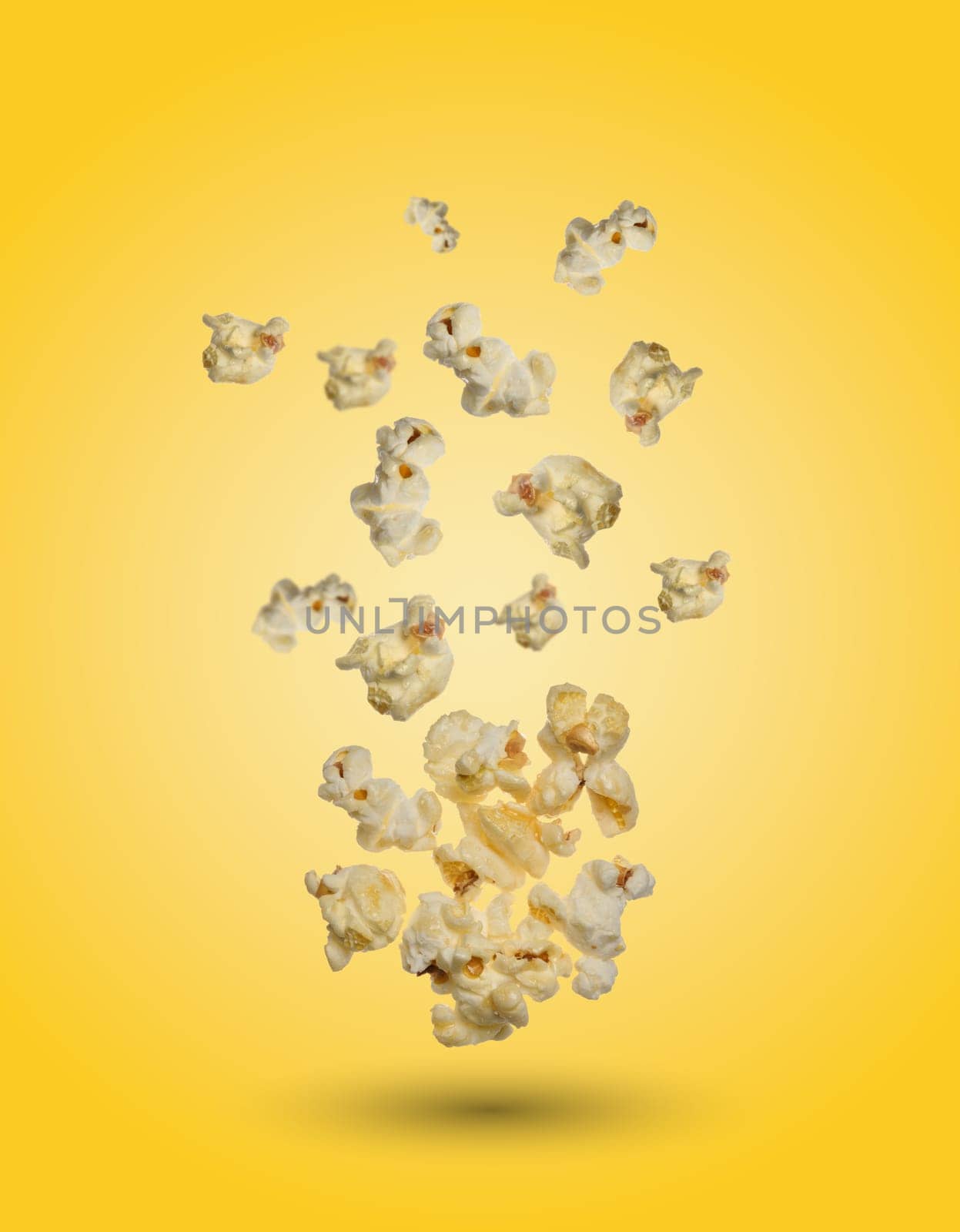 Sweet popcorn on a yellow background by ndanko