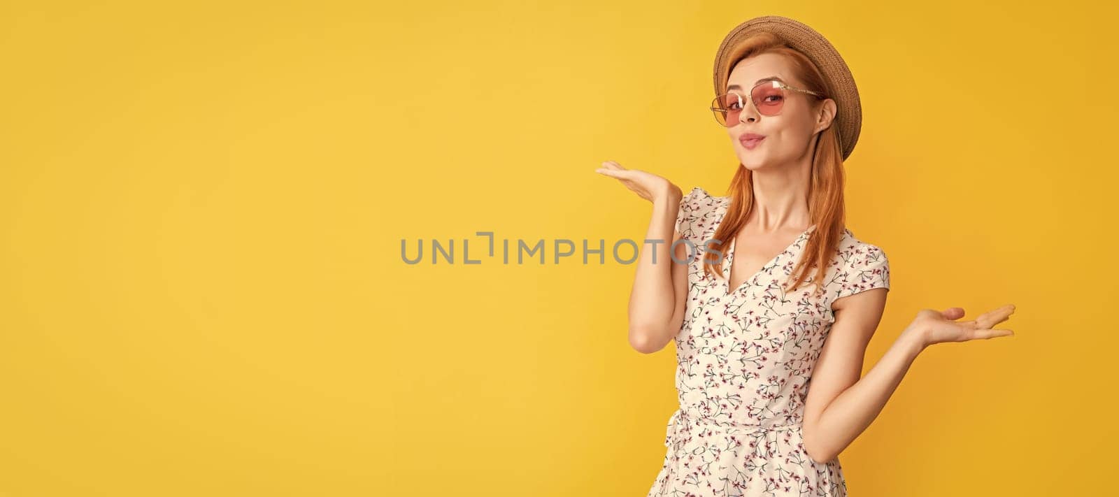Woman isolated face portrait, banner with copy space background. positive young woman in straw hat and sunglasses on yellow background. by RedFoxStudio