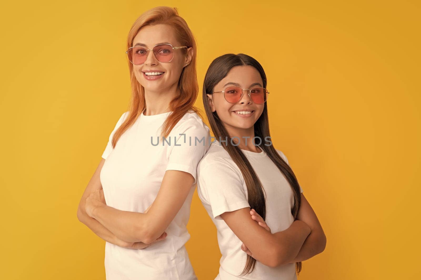 happy confident family portrait of single mom and child girl in glasses, fashion accessory.