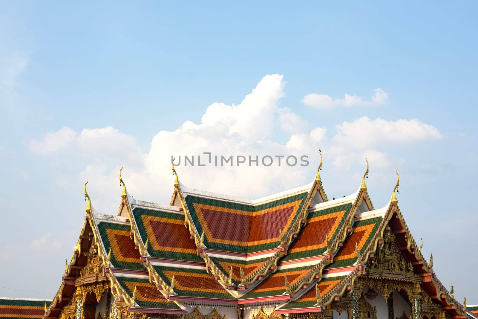 Roof of Thai temple with blue sky And cloudy. Thai style roof of Buddhist temple with blue sky.