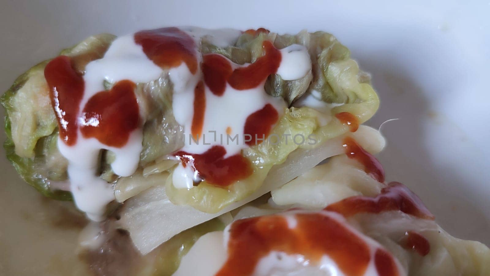 food cabbage rolls cabbage rolls, mayonnaise sauce and ketchup. High quality photo