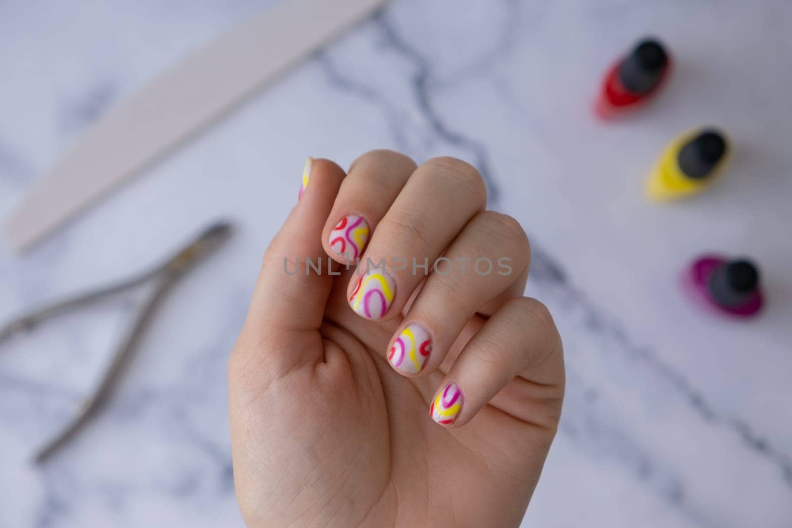 Stylish colorful summer female nails. Modern trendy stylish Beautiful manicure. Cute pastel nail minimalistic design concept of beauty treatment. Gel nails. Skin care. Beautician