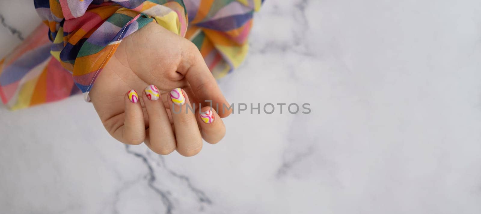 Woman manicured hands, stylish summer colorful nails. Closeup of manicured nails of female hand. Summer style of nail design concept. Beauty by anna_stasiia