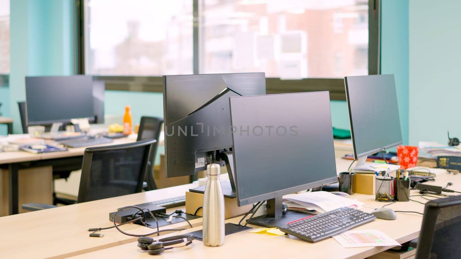 Modern coworking space with laptop empty of people