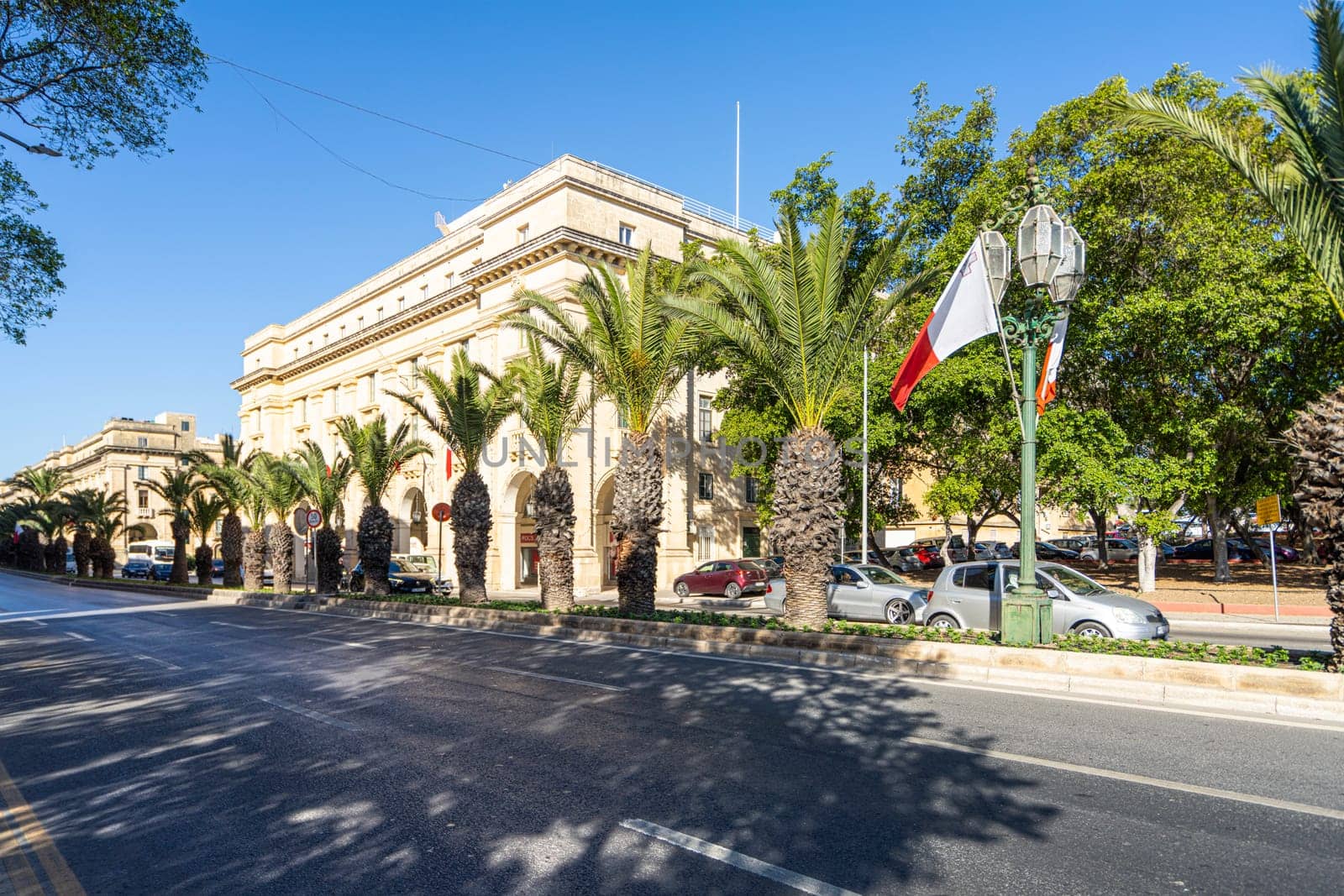 Valletta, Malta, April 03, 2024. a palm tree-lined avenue in the city center