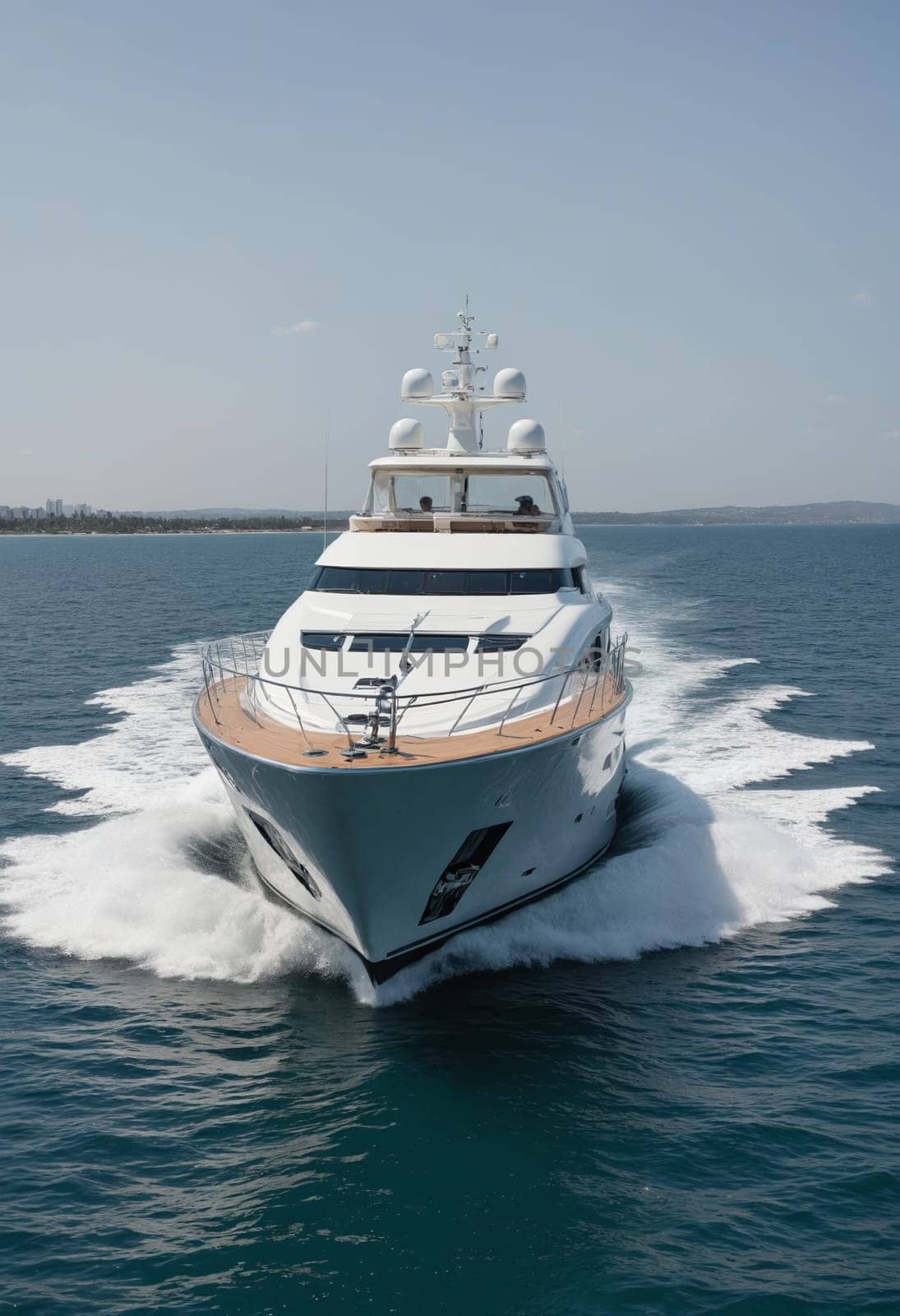 A luxurious yacht makes its way across serene seas under a clear sky, epitomizing elegance and adventure.