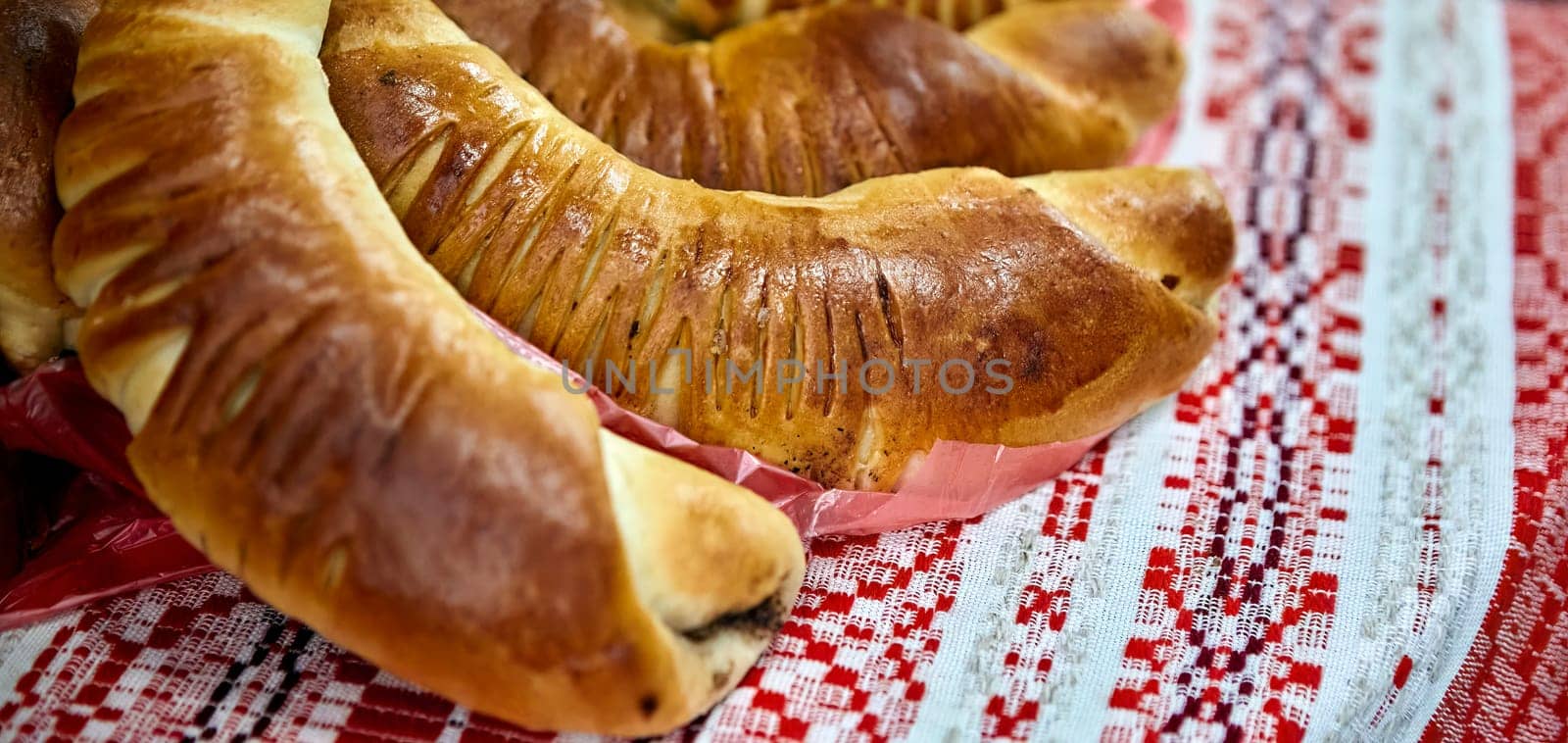 Delicious Homemade Puff Pastry Horns with Chocolate Cream on Red Checkered Tablecloth by Hil