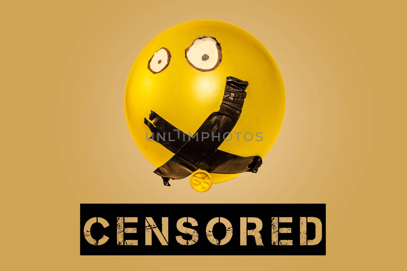 Illuminate the stifling effects of censorship and cancel culture with this evocative concept image portraying a balloon with its mouth sealed shut by tape.