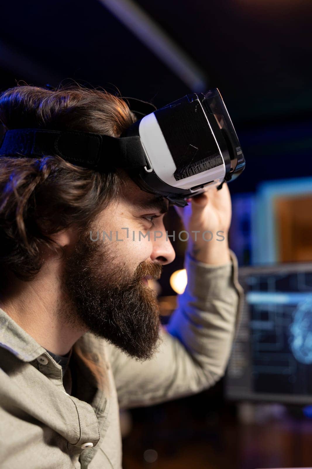 IT expert using virtual reality to make artificial intelligence become sentient, smiling after seeing self awareness signs. Man with VR glasses on happy after achieving AI superintelligence, close up