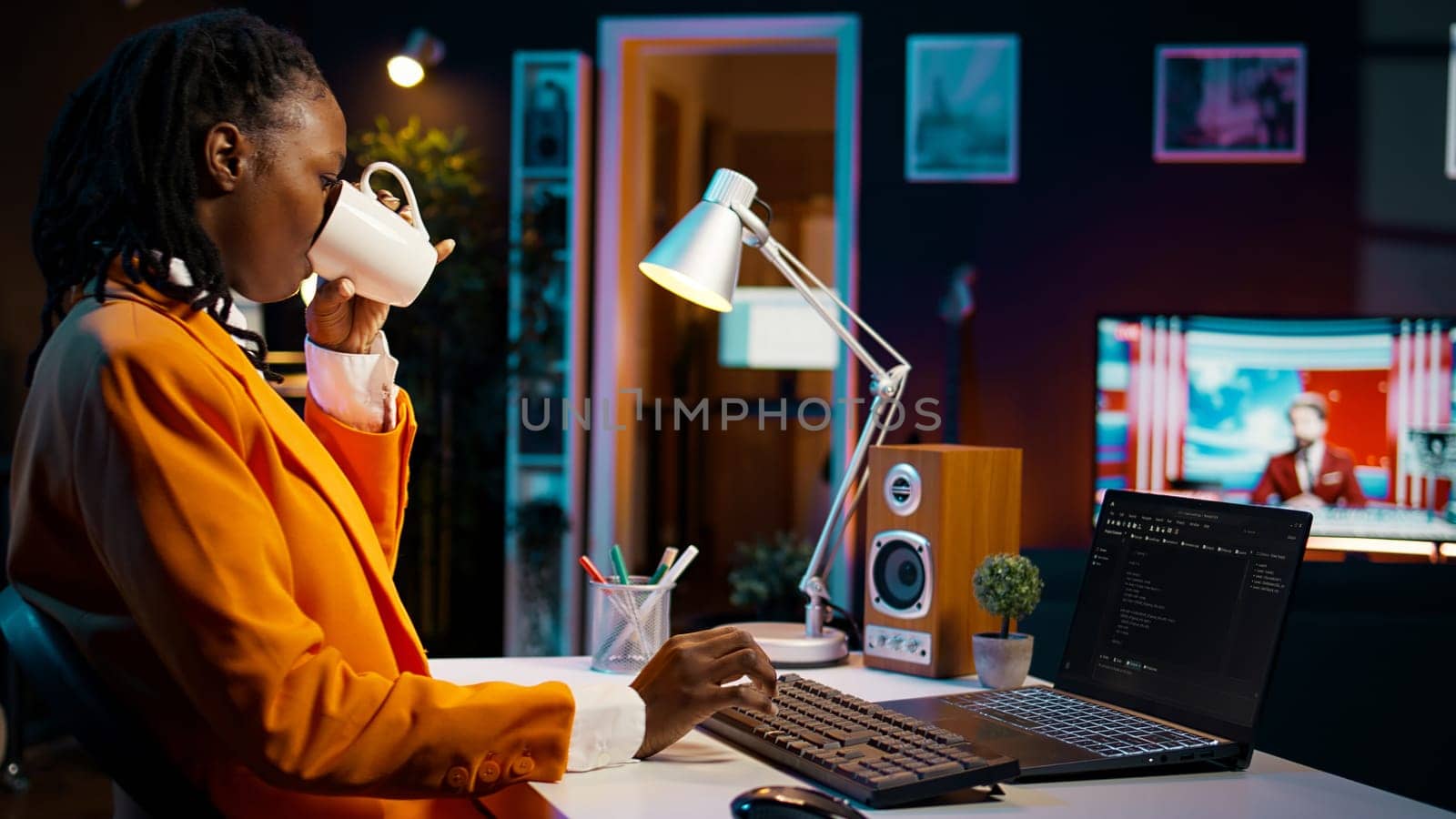 African american IT student practicing coding or programming exercises, learning hardware language and system debugging. Young woman studying database script on html window. Camera B.