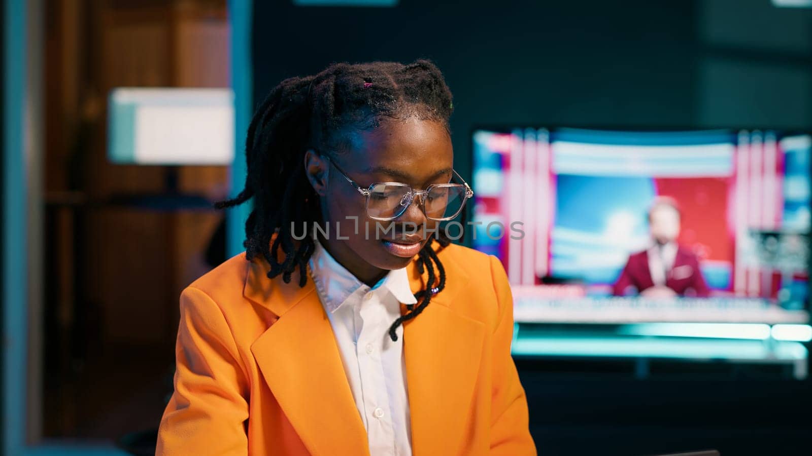 African american student working on her bachelor paper essay at home, writing ideas from online research. Girl exploring digital libraries and academic databases for additional resources. Camera A.