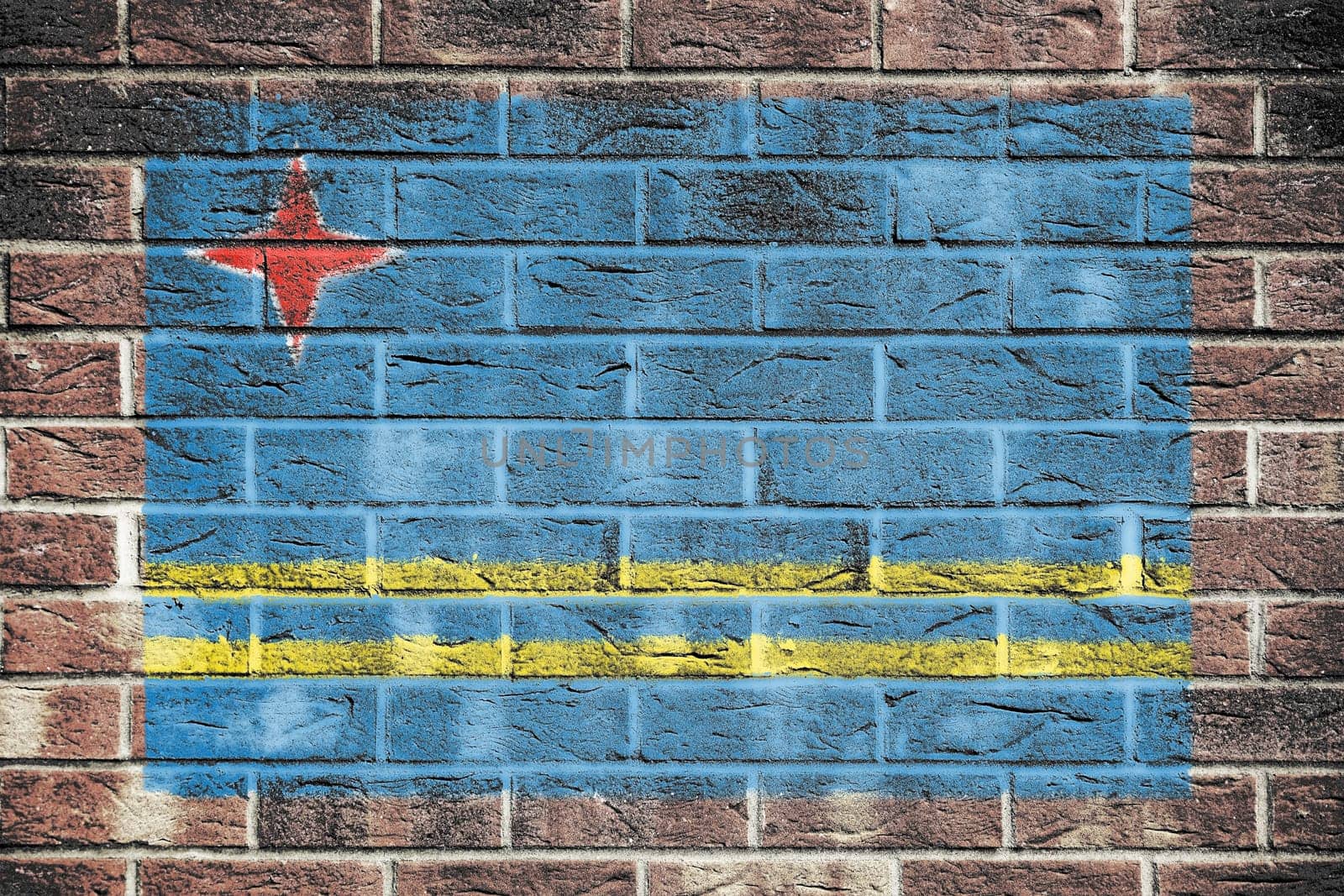 Aruba flag on a brick wall background by VivacityImages