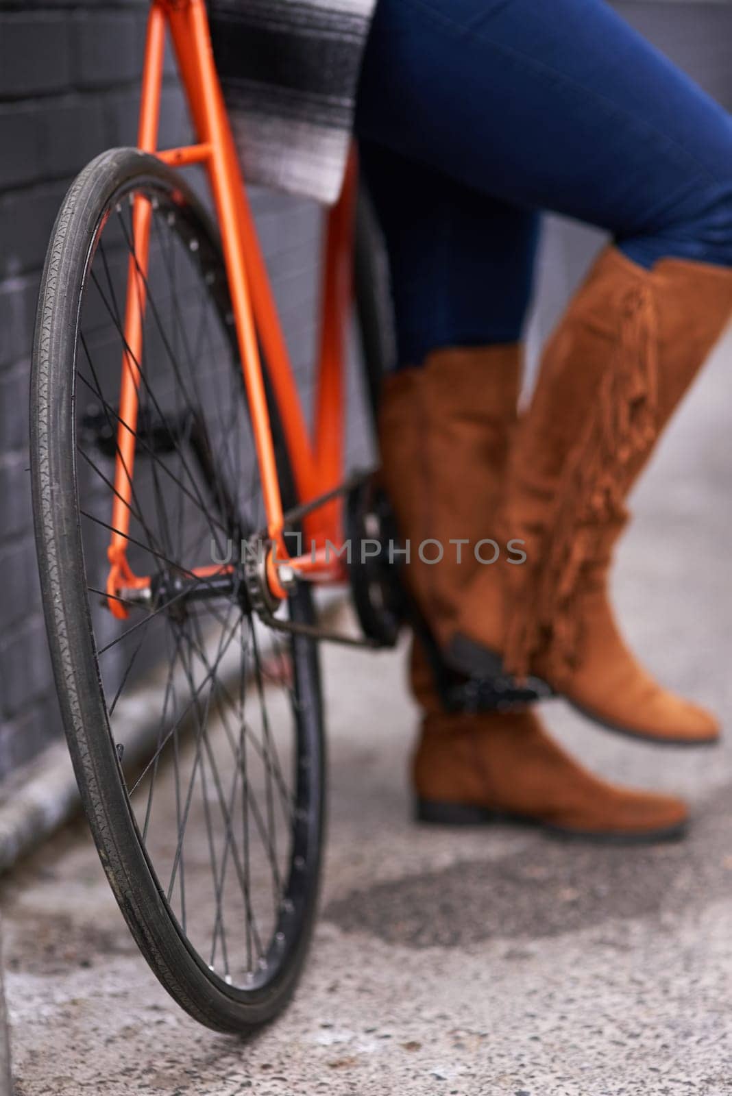Legs, person and bicycle with standing on a road with morning transport and commute with boots. Retro, transportation and cycling on an urban sidewalk with shoes and travel in the city with bike.