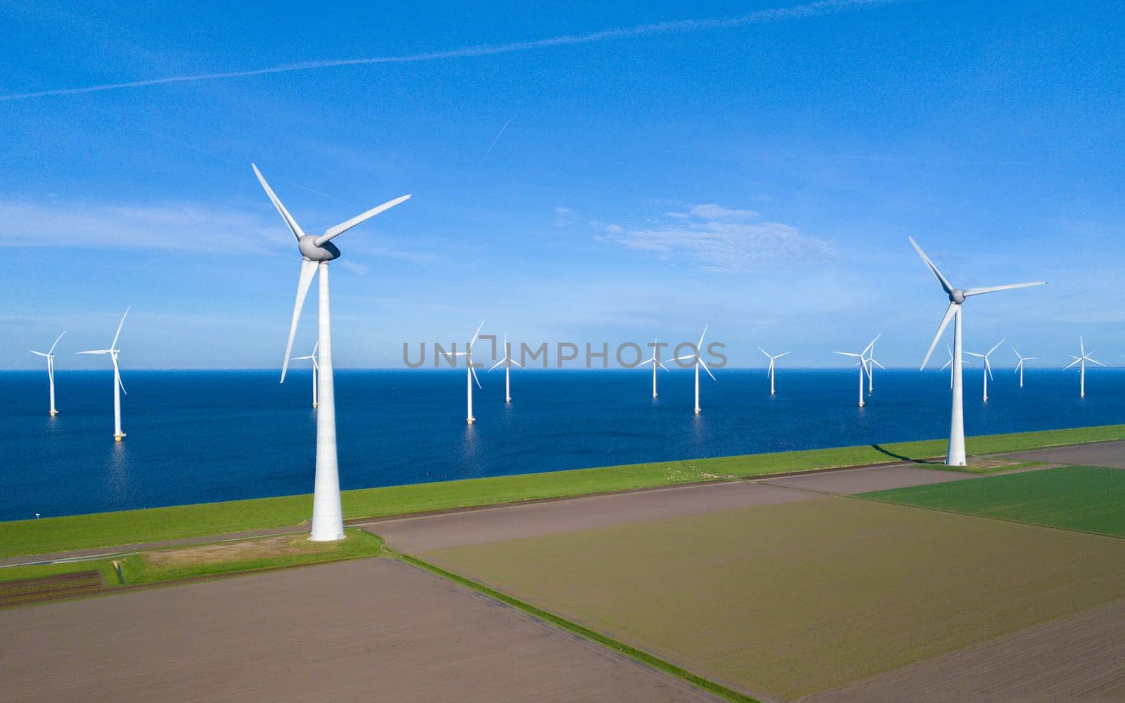 offshore windmill park and a blue sky, windmill park in the ocean. Netherlands Europe by fokkebok