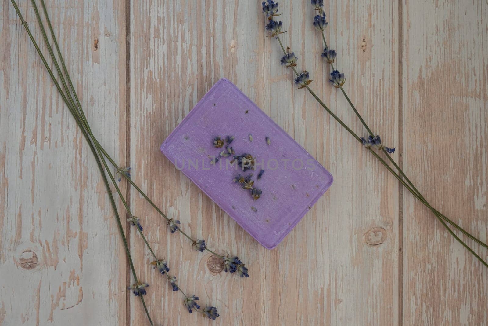 Handmade aromatic spa lavender soap. Natural additives and extracts. Bar of lavender soap with dried flowers. Beauty treatment product herbal ecological organic cosmetics by anna_stasiia