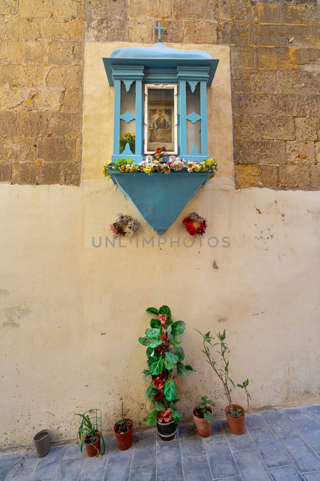 a religious icon on the wall in Valletta, Malta by sergiodv