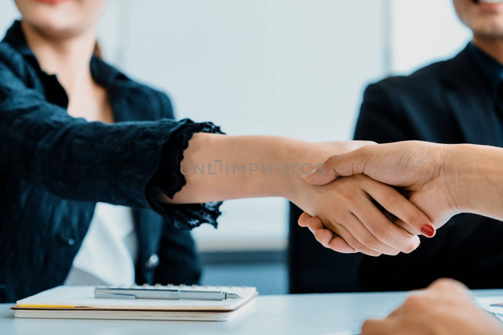 Business people handshake agreement in office. uds by biancoblue