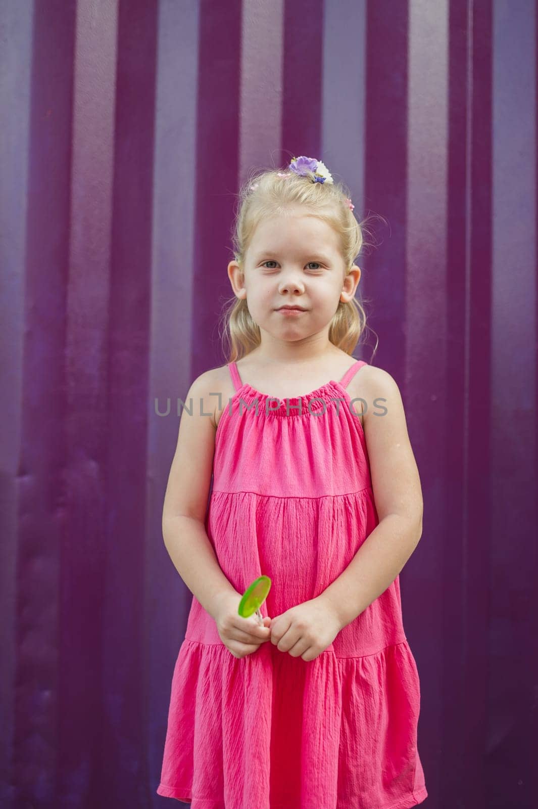 Outdoor portrait of serious sad little caucasian child girl look at camera, unhappy small child kid feel lonely abandoned, outcast or loner miss parents, children drama.