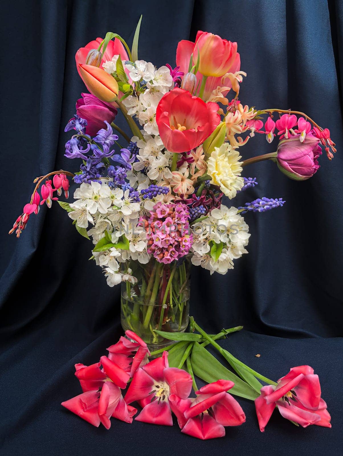 Romantic bouquet of the first garden flowers in a vase. The art of flower arranging