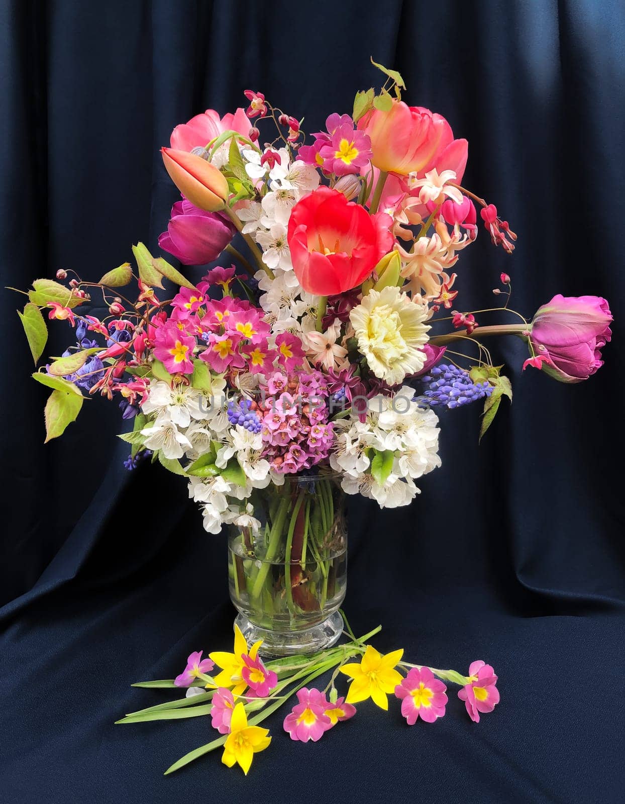 Romantic bouquet of the first garden flowers in a vase. The art of flower arranging