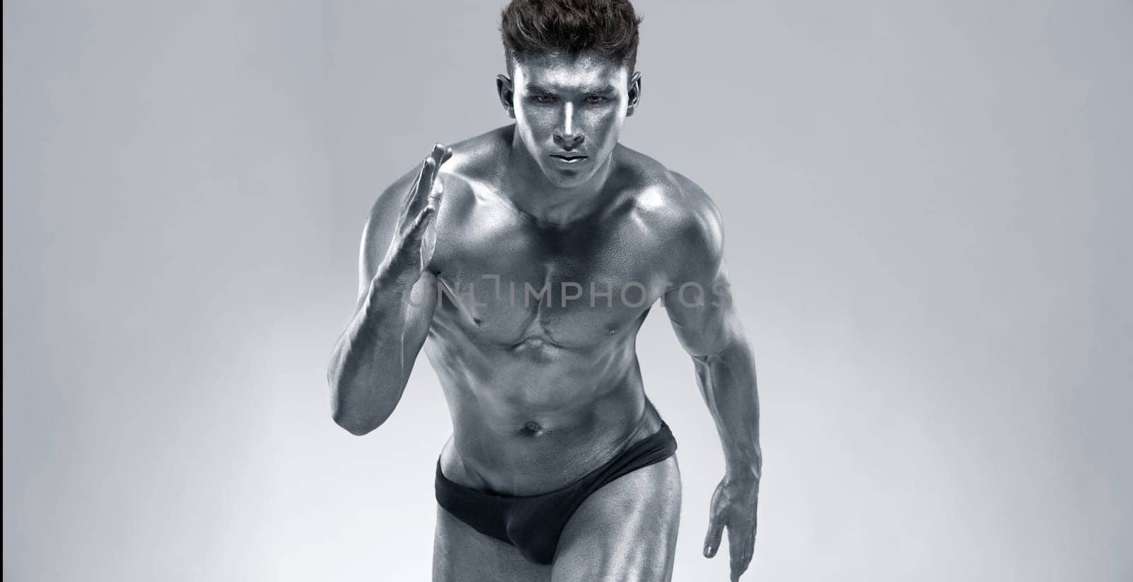 Runner or sprinter concept. Brutal strong muscular bodybuilder athletic man run on light background. Workout bodybuilding banner. by MikeOrlov