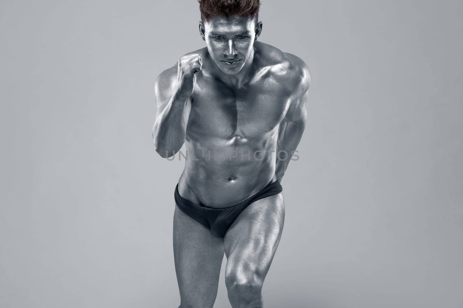 Man with conceptual slver body art.