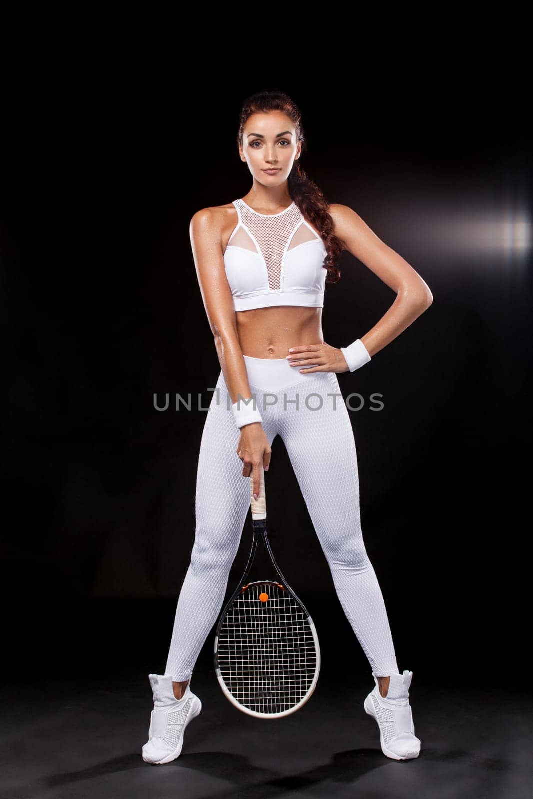 Beautiful sport woman tennis player with racket in white sportswear costume by MikeOrlov