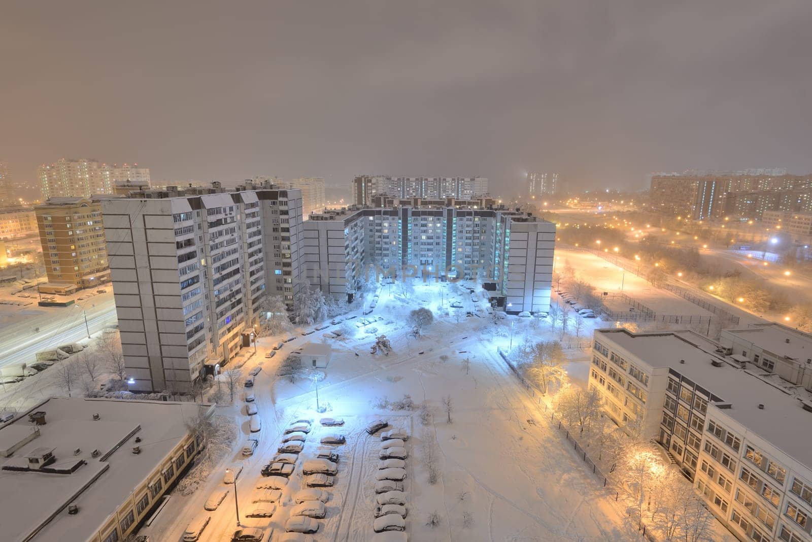 Night city after snowfall in Moscow, Russia by olgavolodina