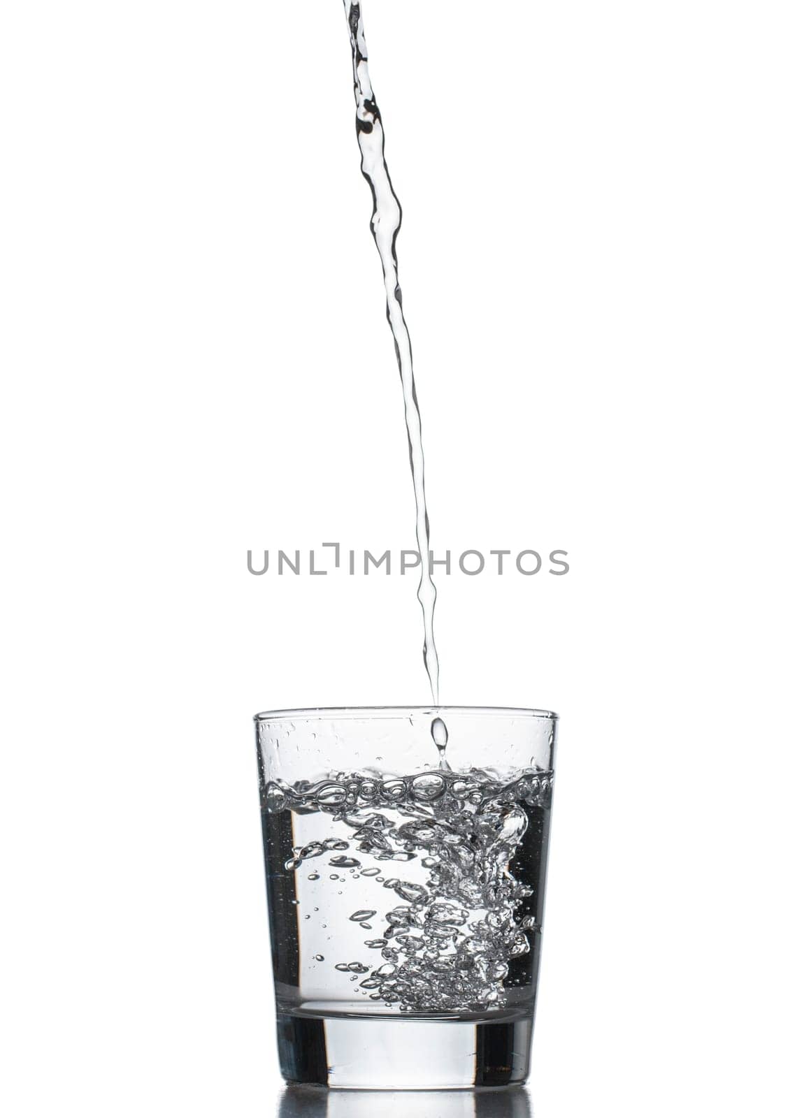 water splashing from glass isolated on white background by fascinadora