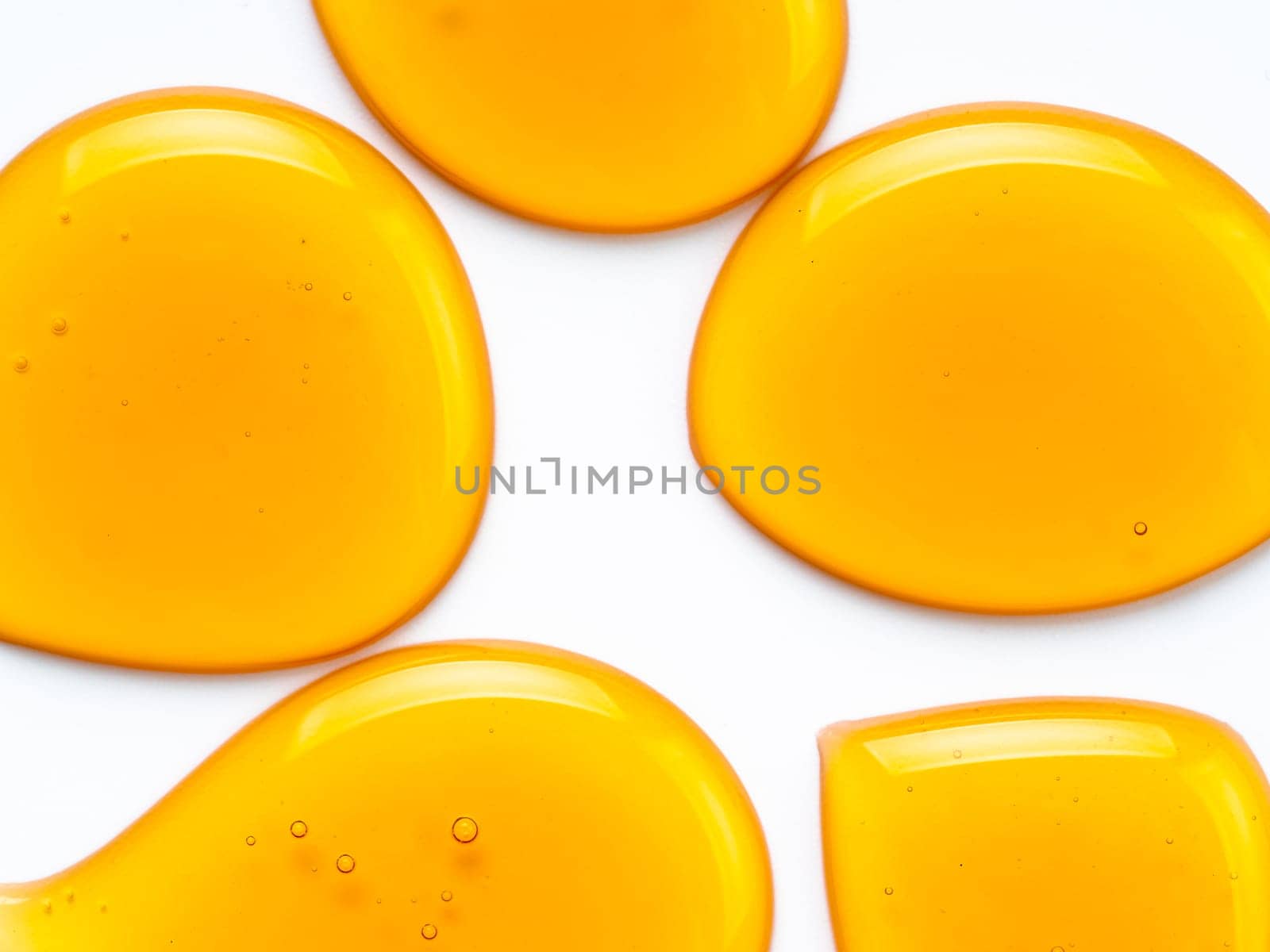 Honey drops. Abstract pattern from honey drops. Isolated on white with clipping path. Can use for design. Copy space for text.
