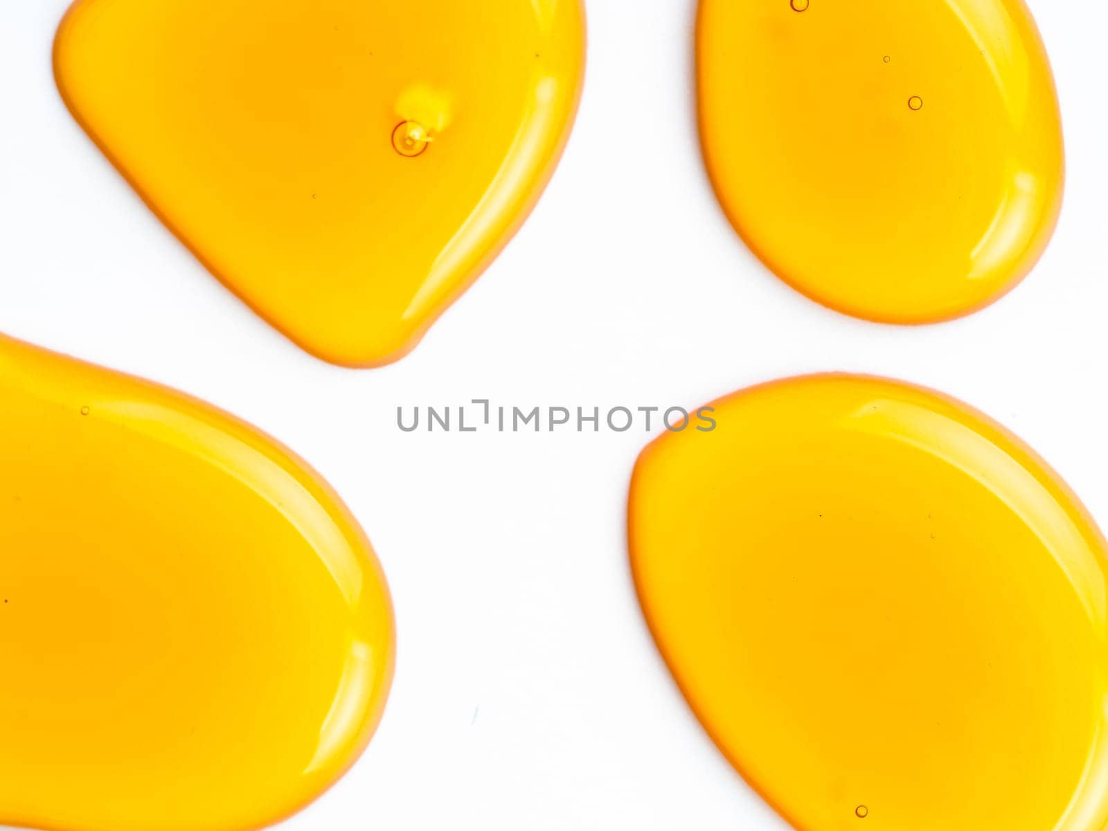 Honey drops. Abstract pattern from honey drops. Isolated on white with clipping path. Can use for design. Copy space for text.