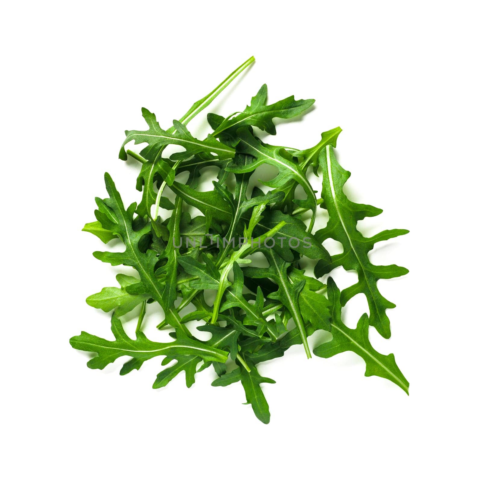 Heap of arugula leaves isolated by fascinadora