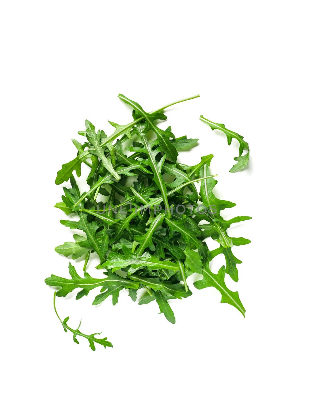 Heap of arugula leaves isolated by fascinadora