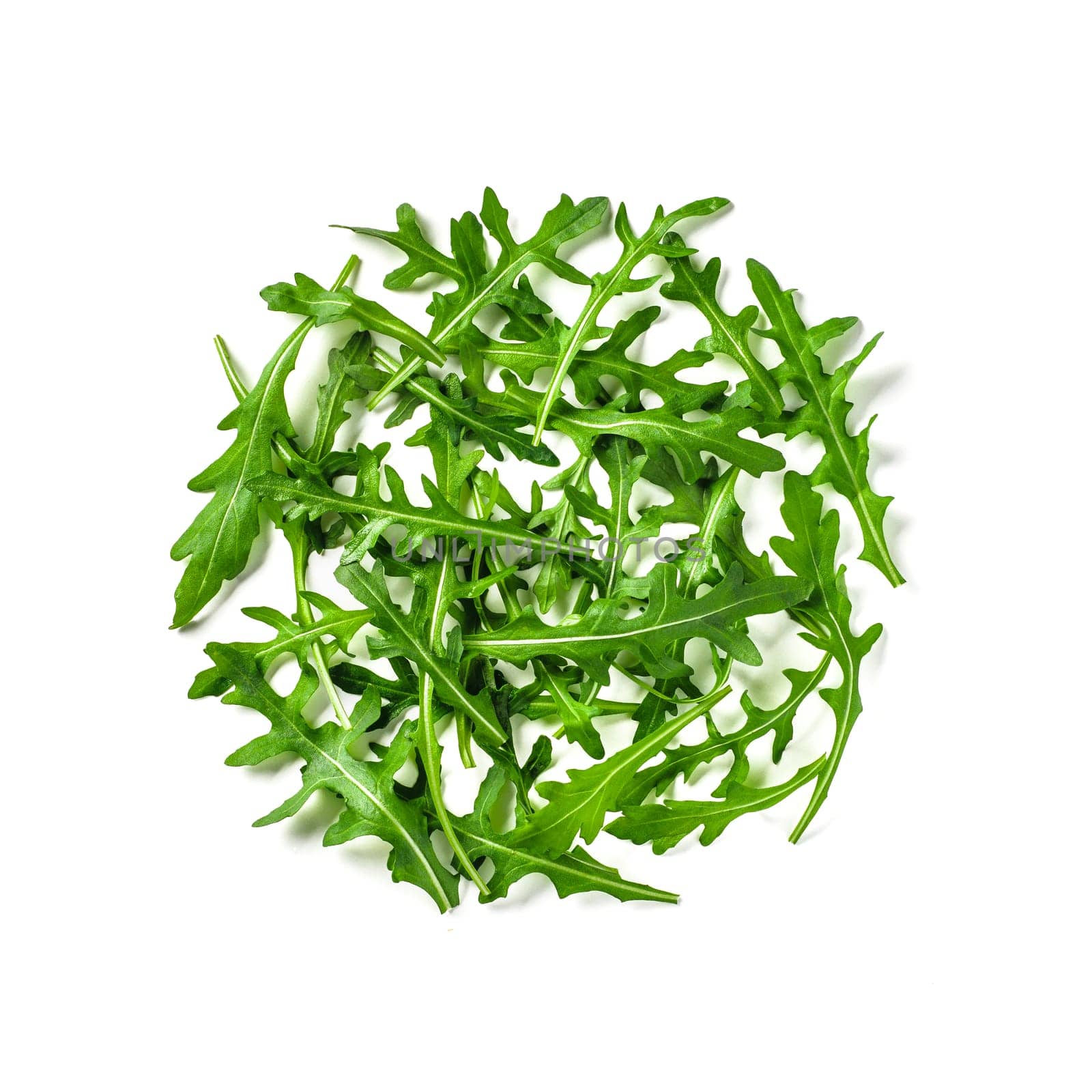 Heap of arugula leaves. Fresh green arugula or rucola leaves isolated on white with clipping path. Top view or flat lay