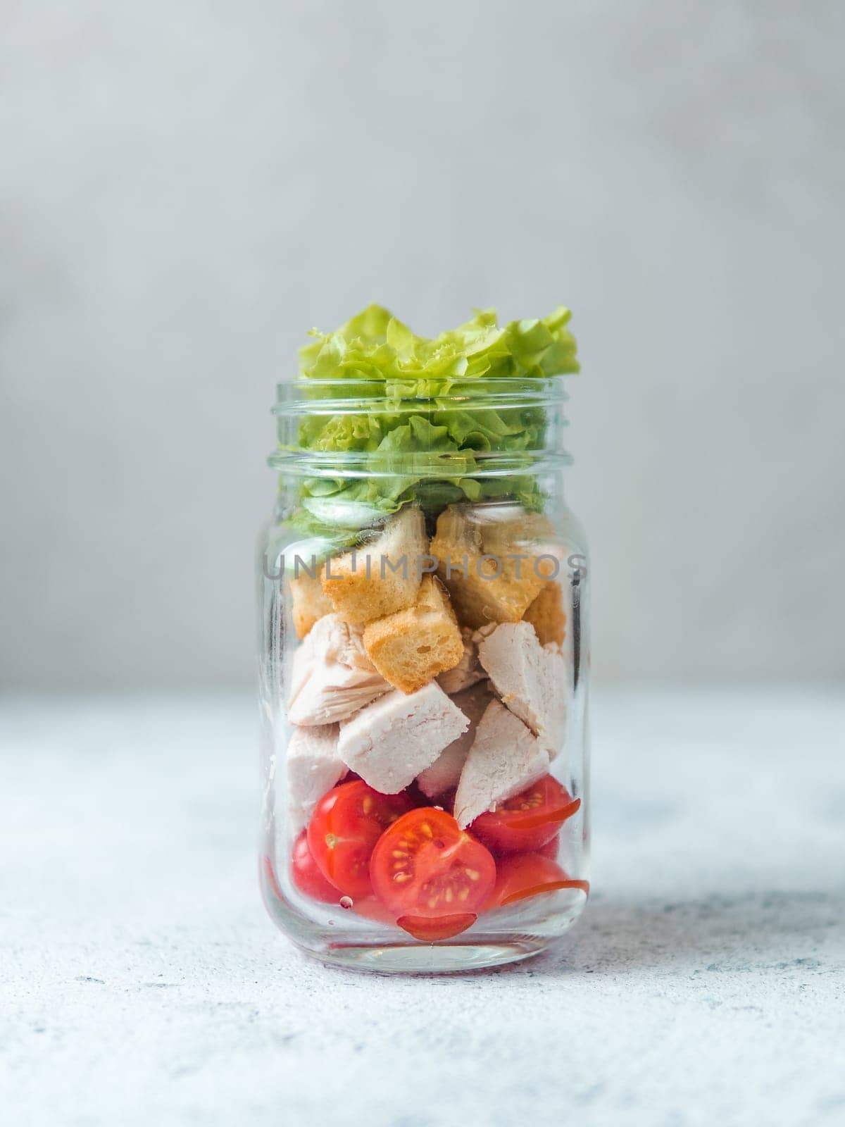 Caesar salad in glass mason jar, copy space by fascinadora