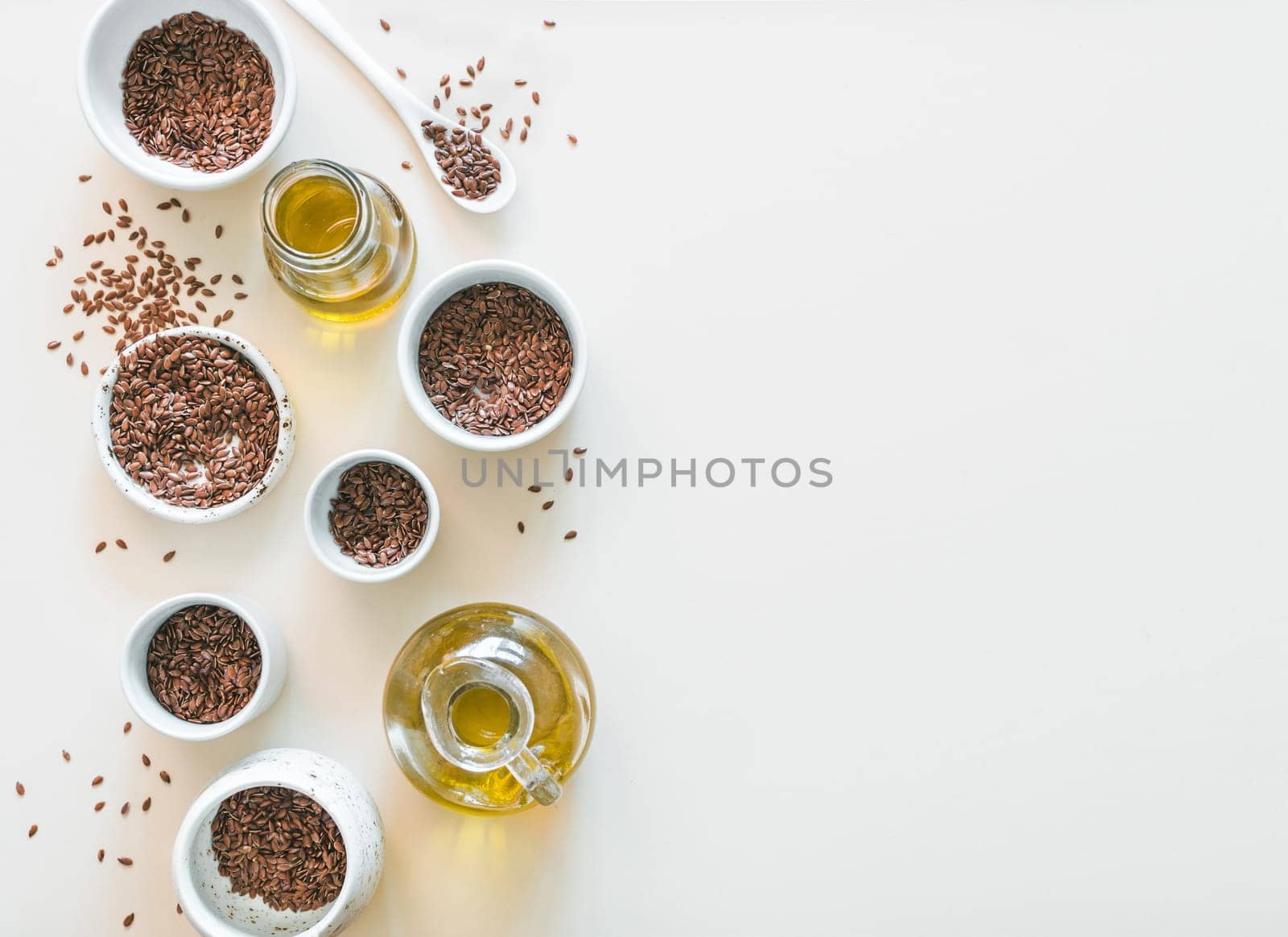 flax seeds and flaxseed oil on white by fascinadora
