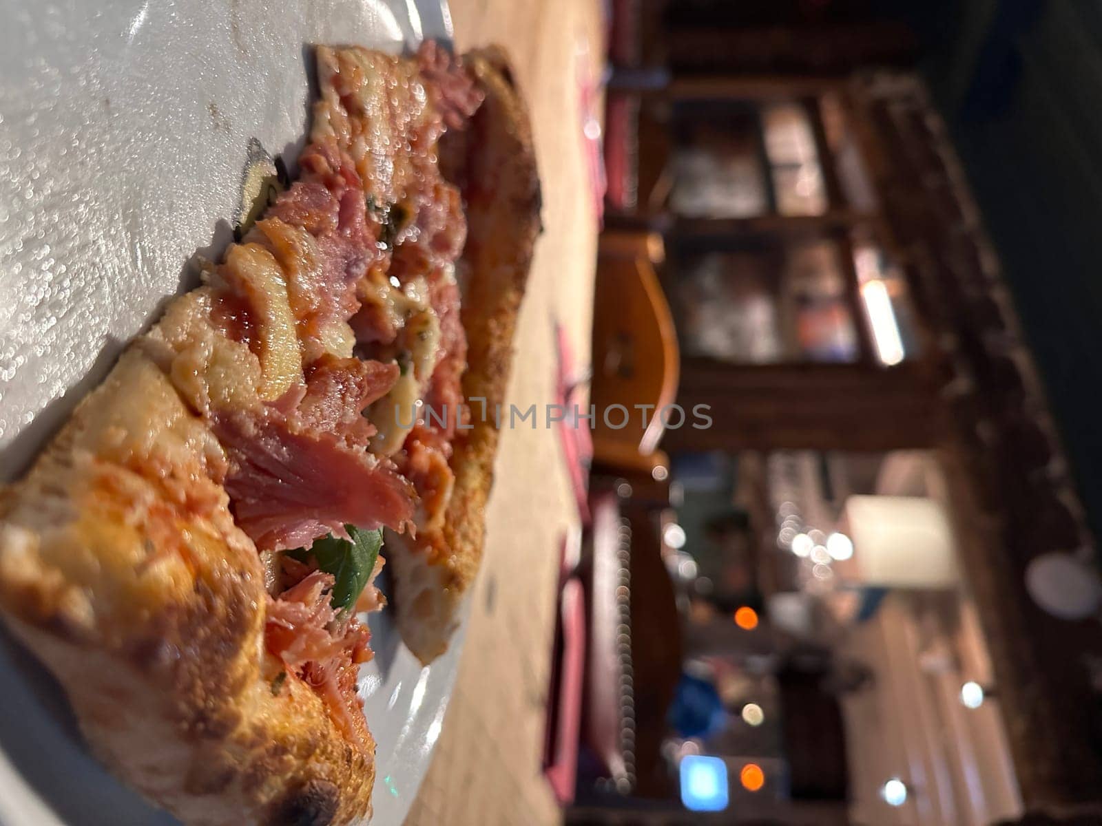 Delicious pizza slice on a plate by MAD_Production