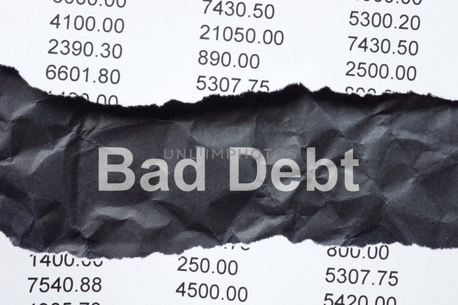 Torn bank statement and inscription bad debt. by designer491