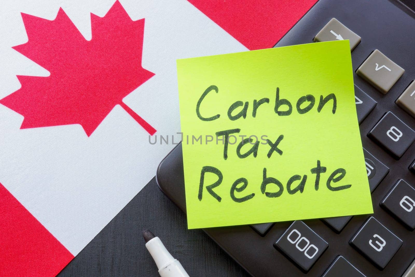 Canada flag and a sticker carbon tax rebate.