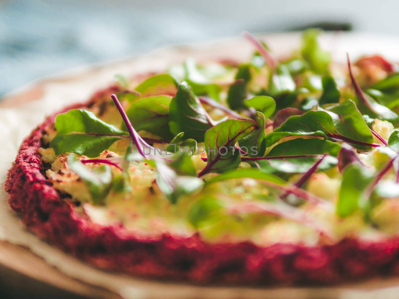 beetroot pizza crust with fresh mangold leaves by fascinadora