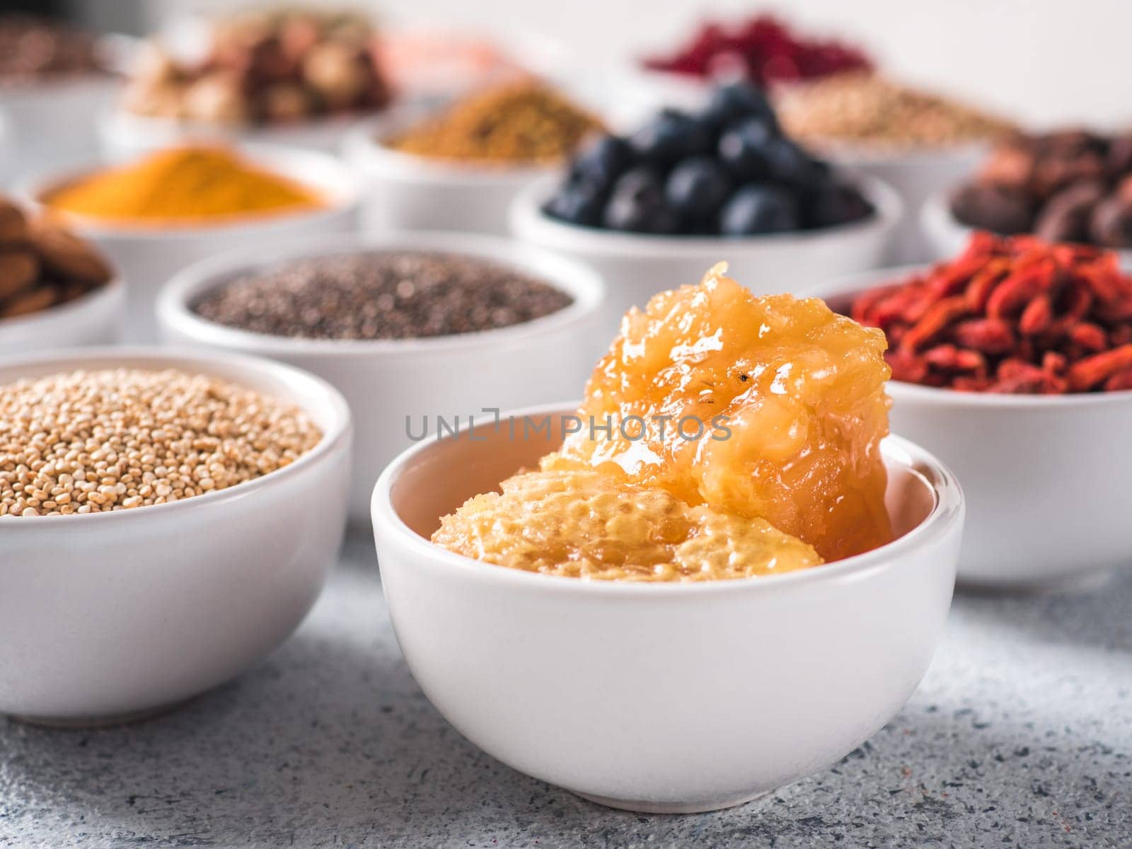 honeycomb in small white bowl and other superfoods by fascinadora