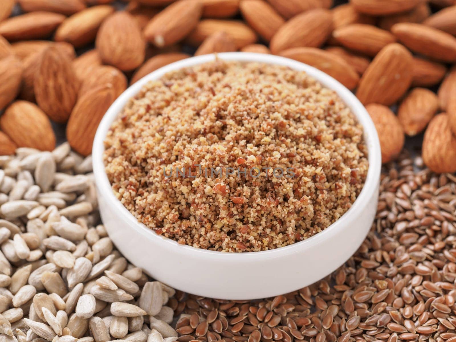 Homemade LSA mix in plate - Linseed or flax seeds, Sunflower seeds and Almonds. Traditional Australian blend of ground, source of dietary fiber, protein, omega fatty acids. Copy space for text.