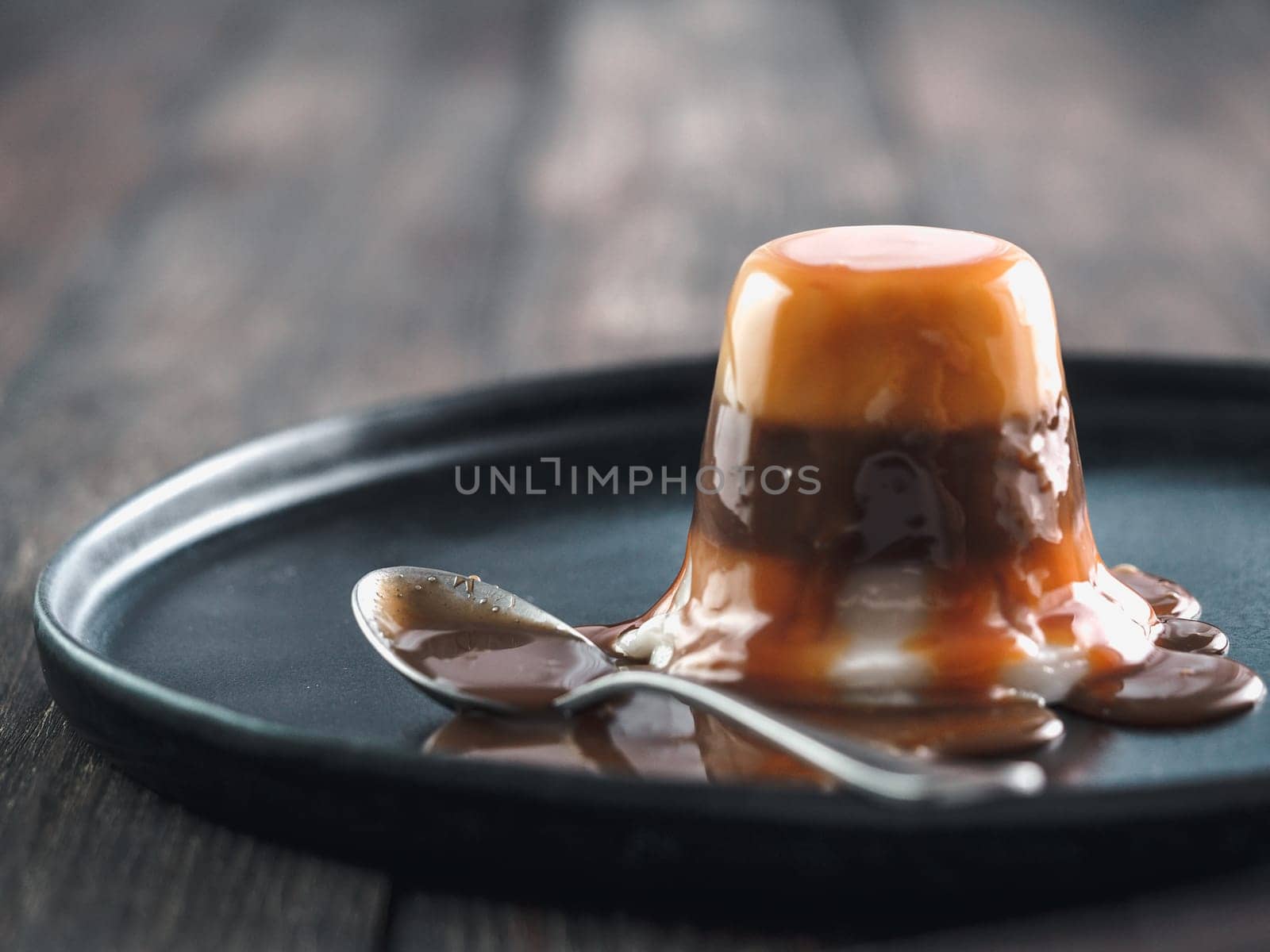 Panna cotta with caramel sauce , copy space by fascinadora