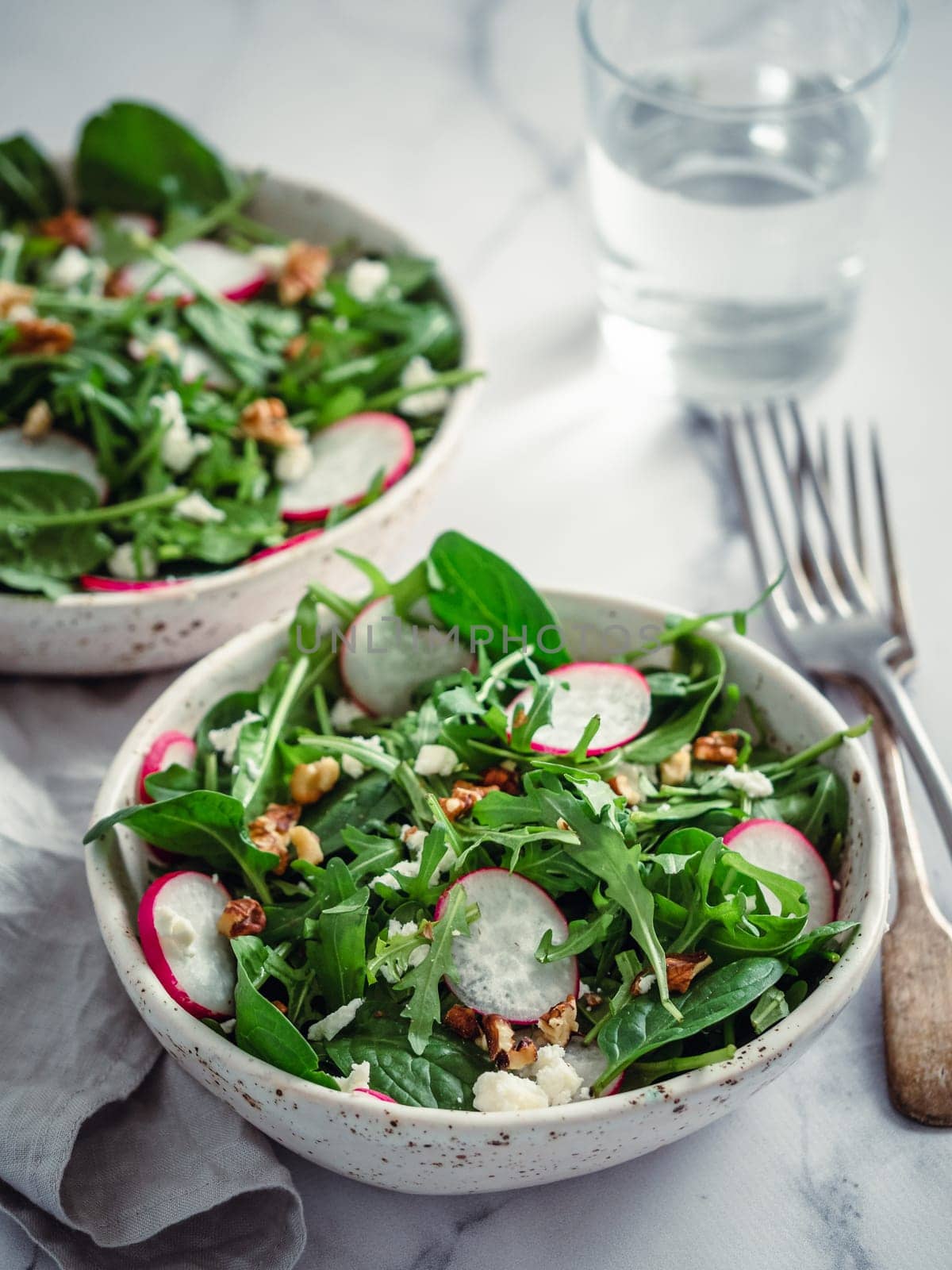 Salad bowl with arugula, spinach, radish, cheese by fascinadora