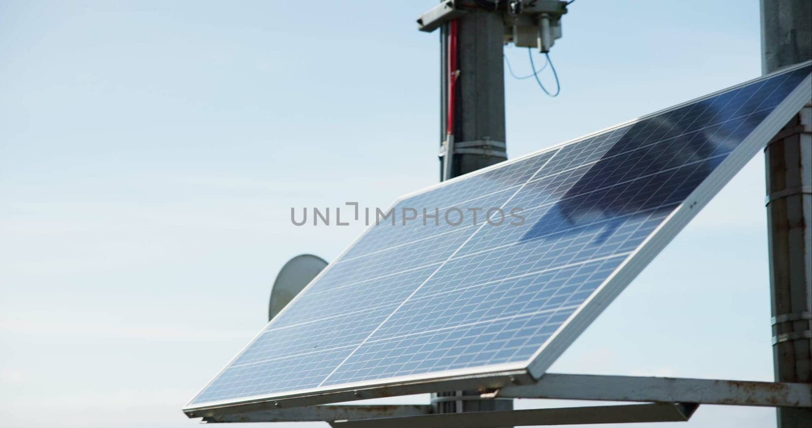 Solar energy, industry and roof with sky background, closeup and sustainability for power in off grid development. Photovoltaic tech, electricity and outdoor with ecology for environment in Tokyo by YuriArcurs