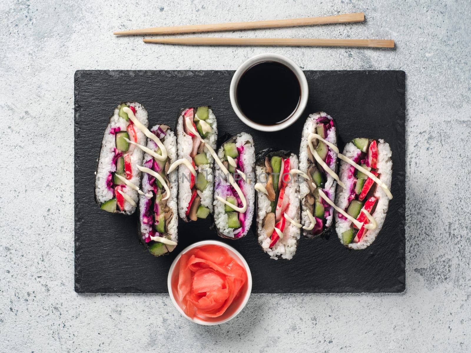 Vegan sushi sandwich onigirazu with mushrooms and vegetables. Healthy dinner recipe and idea. Colorful japan sandwich onigirazu with red cabbage,radish,cucumber,mushrooms. Trend food. Top view