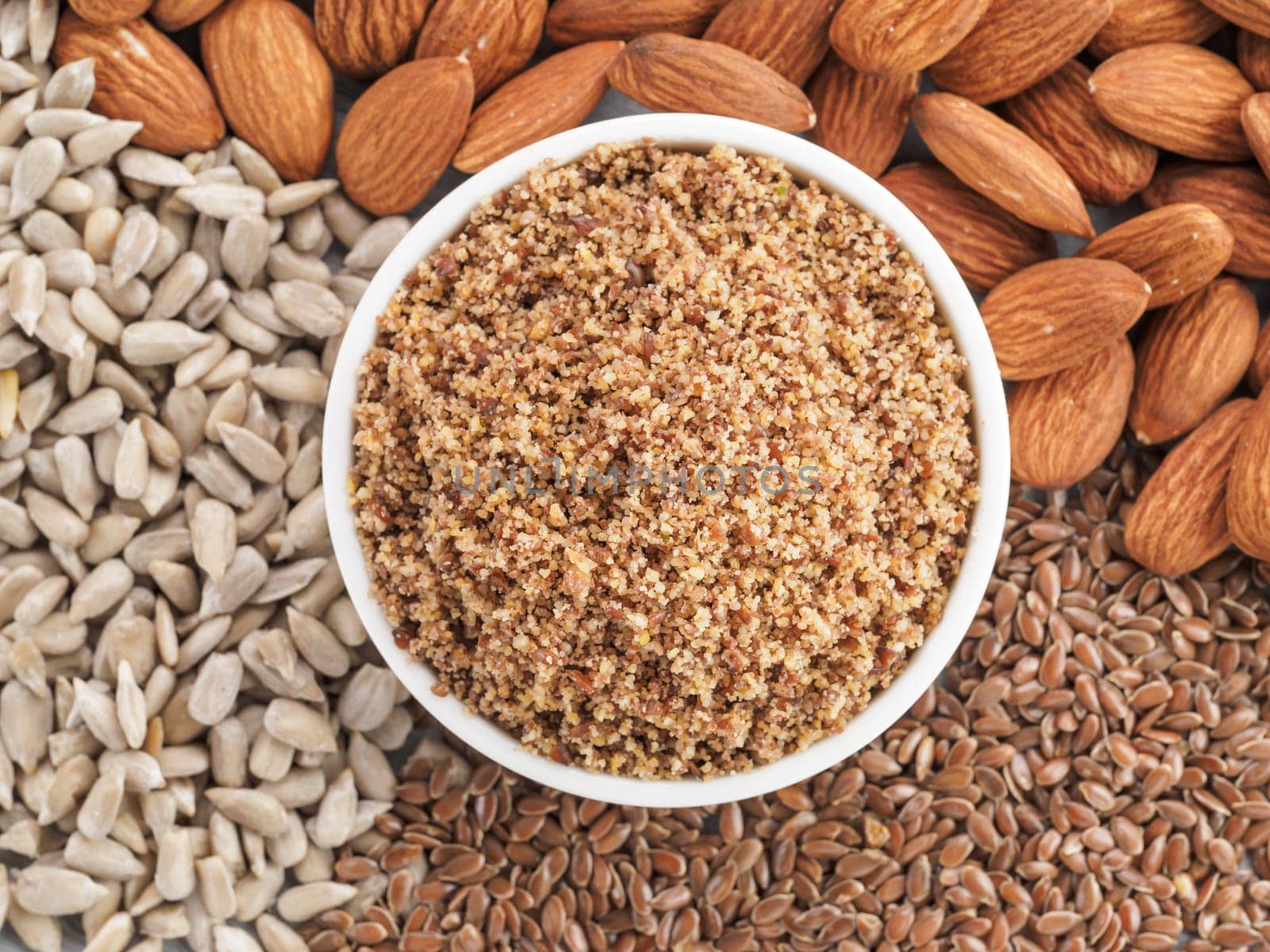 Homemade LSA mix in plate - Linseed or flax seeds, Sunflower seeds and Almonds. Traditional Australian blend of ground, source of dietary fiber, protein, omega fatty acids.Copy space for text.Top view