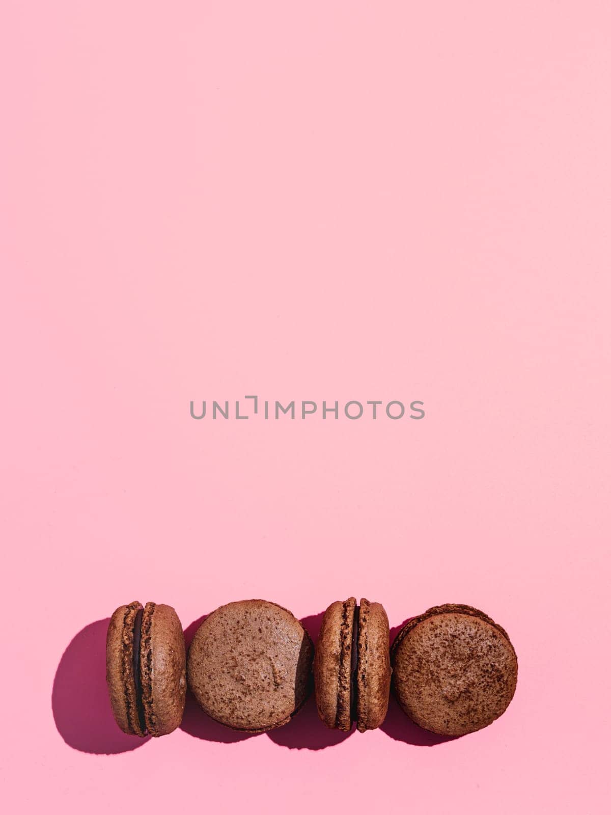 Macarons on pink, copy space, hard light by fascinadora